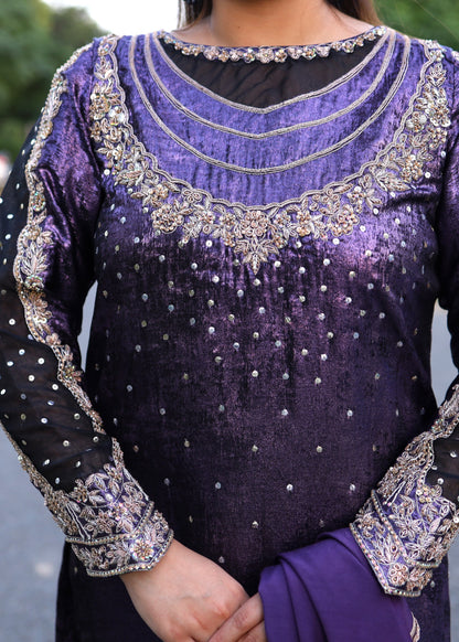 Purple traditional outfit with intricate silver embroidery