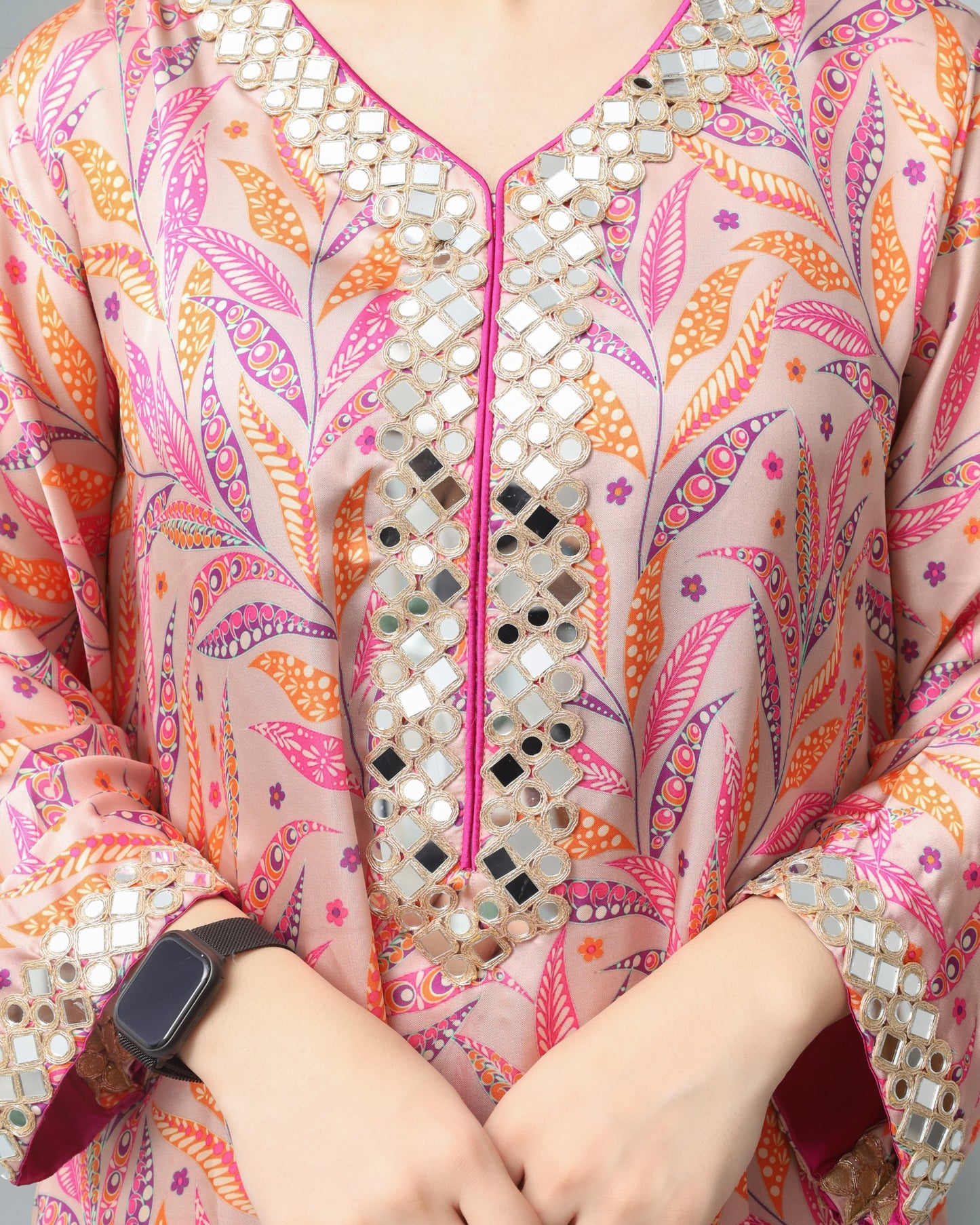 Colorful patterned garment with mirror work details