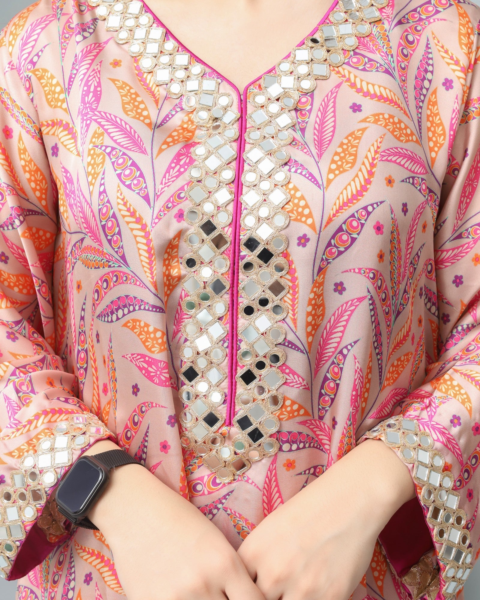 Colorful patterned garment with mirror work details