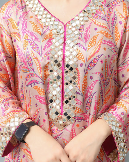 Colorful patterned garment with mirror work details